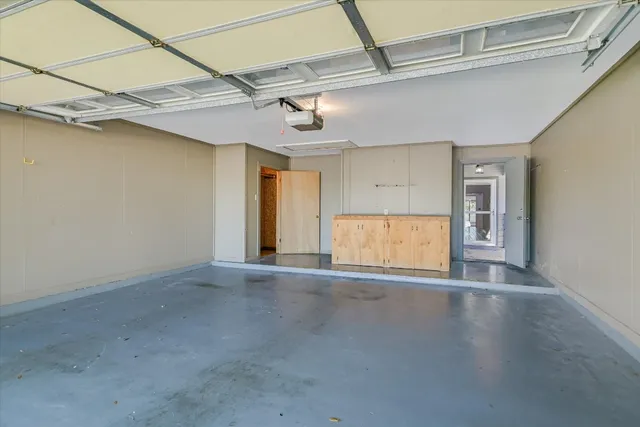 a view of swimming pool with outdoor seating and trees