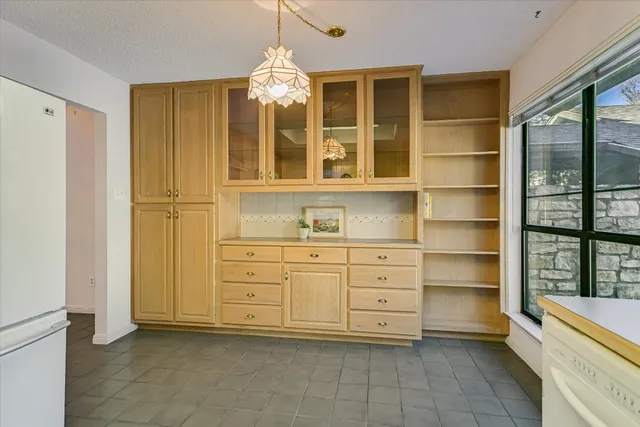 a room with cabinets and a window