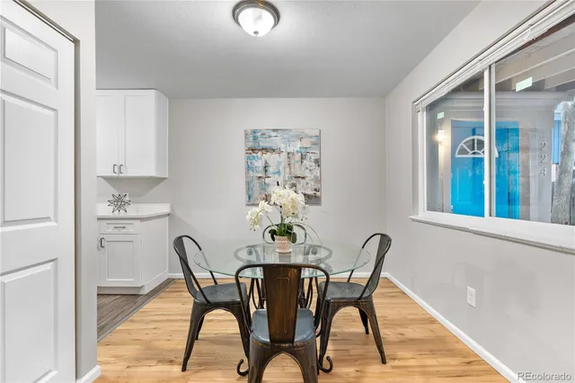 a dining room with furniture and window