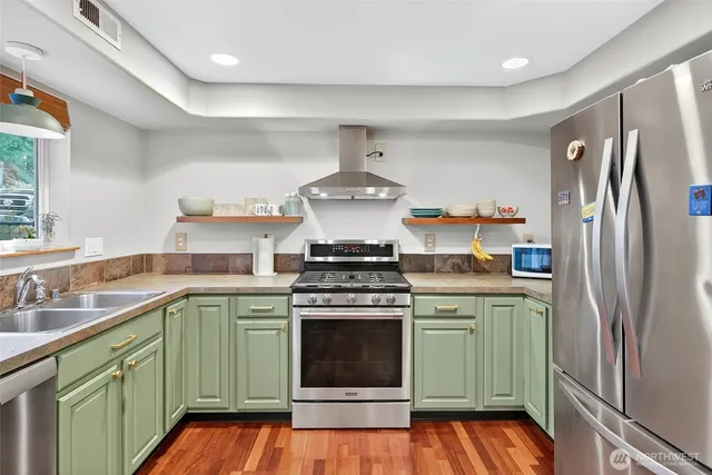a kitchen with a stove and a refrigerator