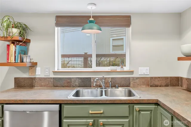 a kitchen with a sink and a window
