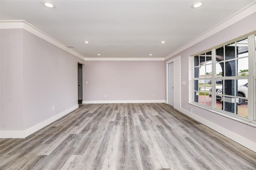 22500 Labrador Street Boca Raton, FL 33428 - Photo 11 of 27 a view of empty room with wooden floor and fan