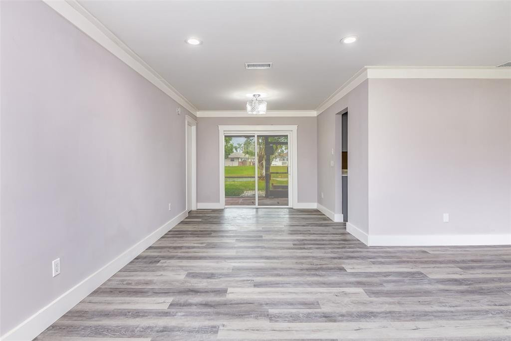 22500 Labrador Street Boca Raton, FL 33428 - Photo 12 of 27 a view of an empty room with wooden floor and a window