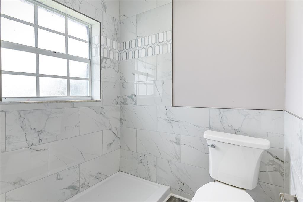 22500 Labrador Street Boca Raton, FL 33428 - Photo 20 of 27 a white toilet sitting next to a bathroom sink