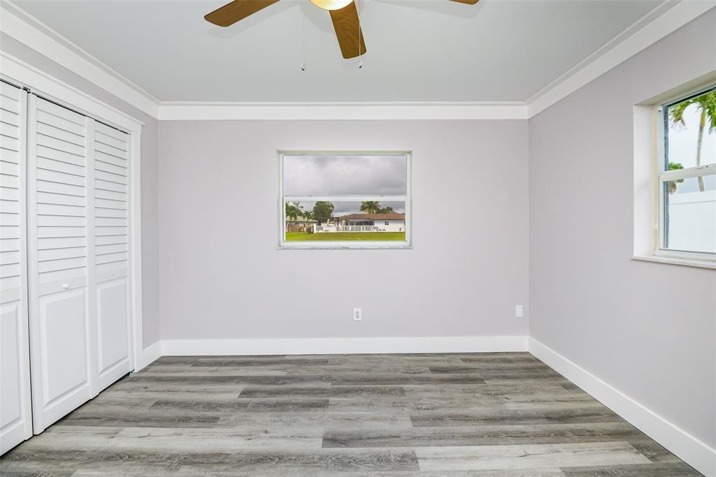 22500 Labrador Street Boca Raton, FL 33428 - Photo 24 of 27 a view of an empty room with window and wooden floor