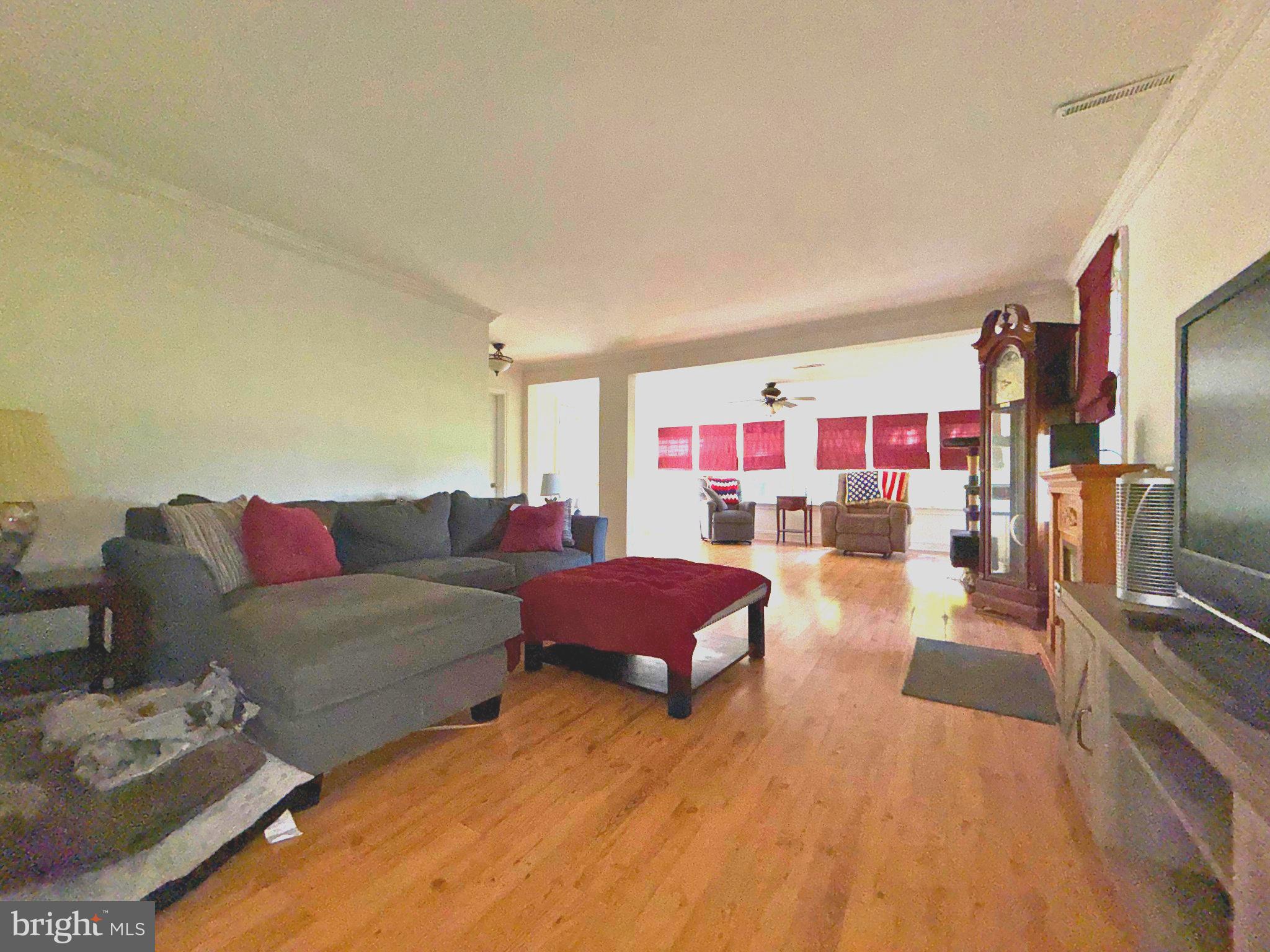 4818 Piney Neck Road Rock Hall, MD 21661 - Photo 6 of 24 a living room with furniture and a flat screen tv