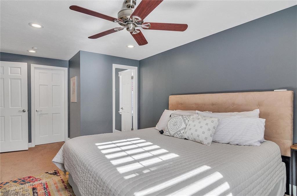 2389 Mill Grove Road Pittsburgh, PA 15241 - Photo 12 of 25 a bedroom with a bed and a ceiling fan