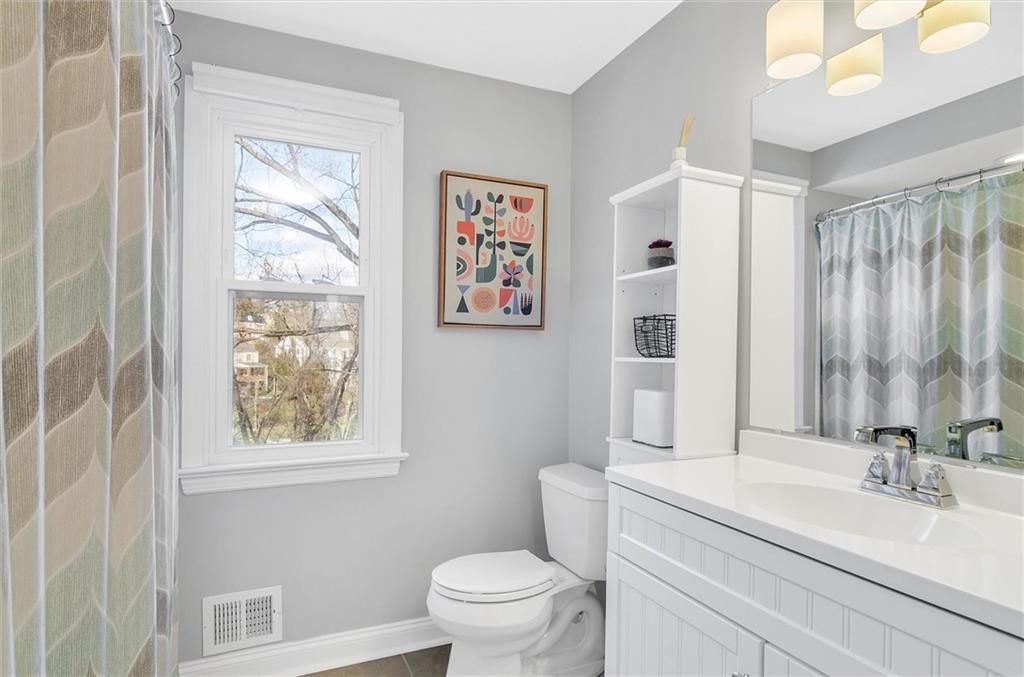 2389 Mill Grove Road Pittsburgh, PA 15241 - Photo 18 of 25 a bathroom with a sink a toilet and a large mirror