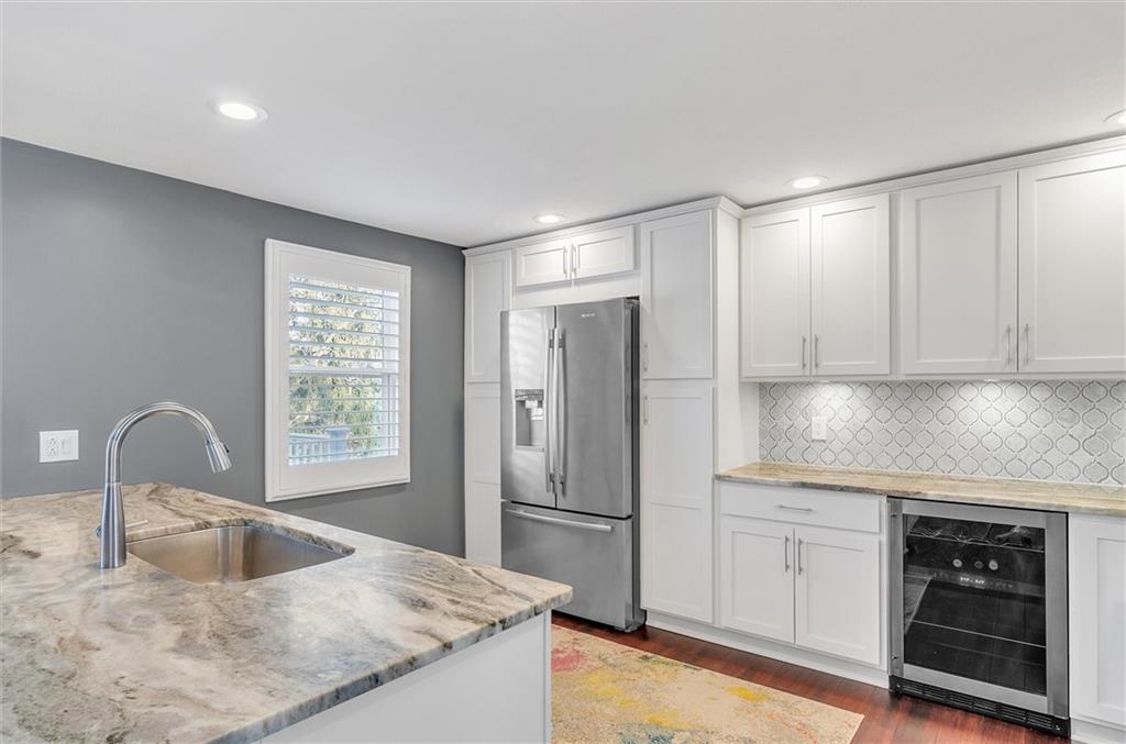 2389 Mill Grove Road Pittsburgh, PA 15241 - Photo 9 of 25 a kitchen with granite countertop a refrigerator and a sink
