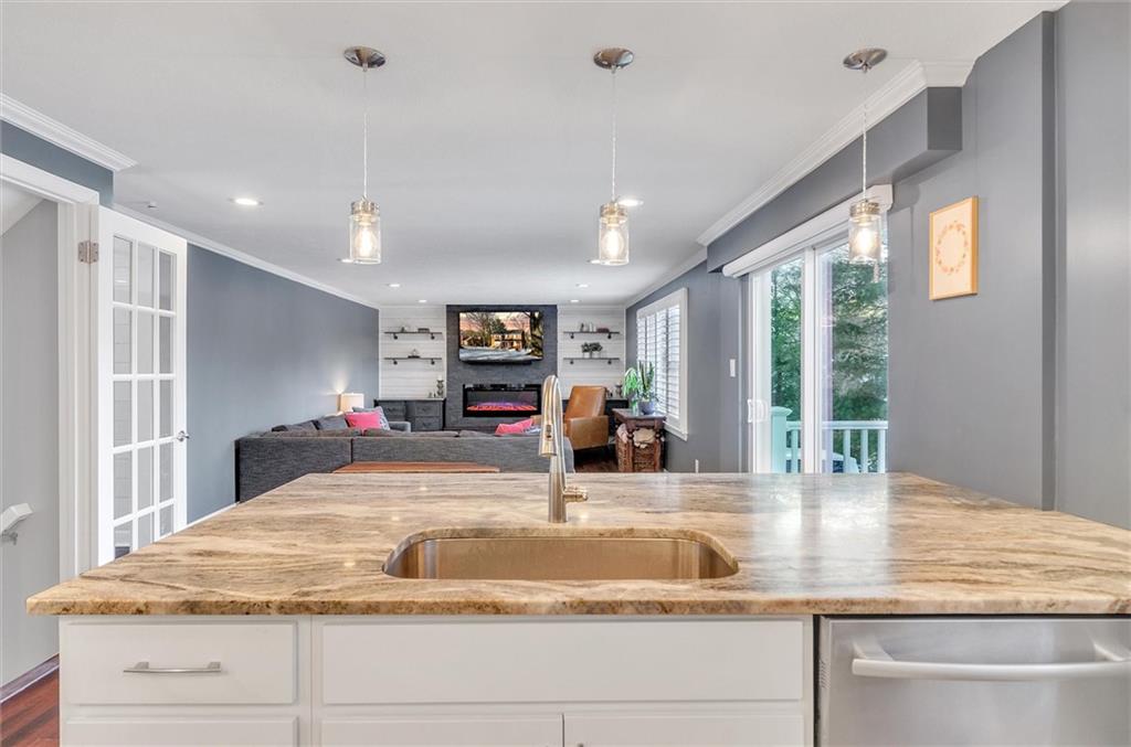 2389 Mill Grove Road Pittsburgh, PA 15241 - Photo 10 of 25 a view of kitchen with kitchen island a large window cabinets and stainless steel appliances