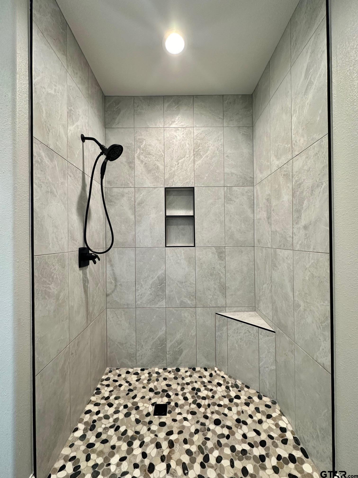 229 Brooks Drive Gladewater, TX 75647 - Photo 32 of 46 a bathroom with a shower