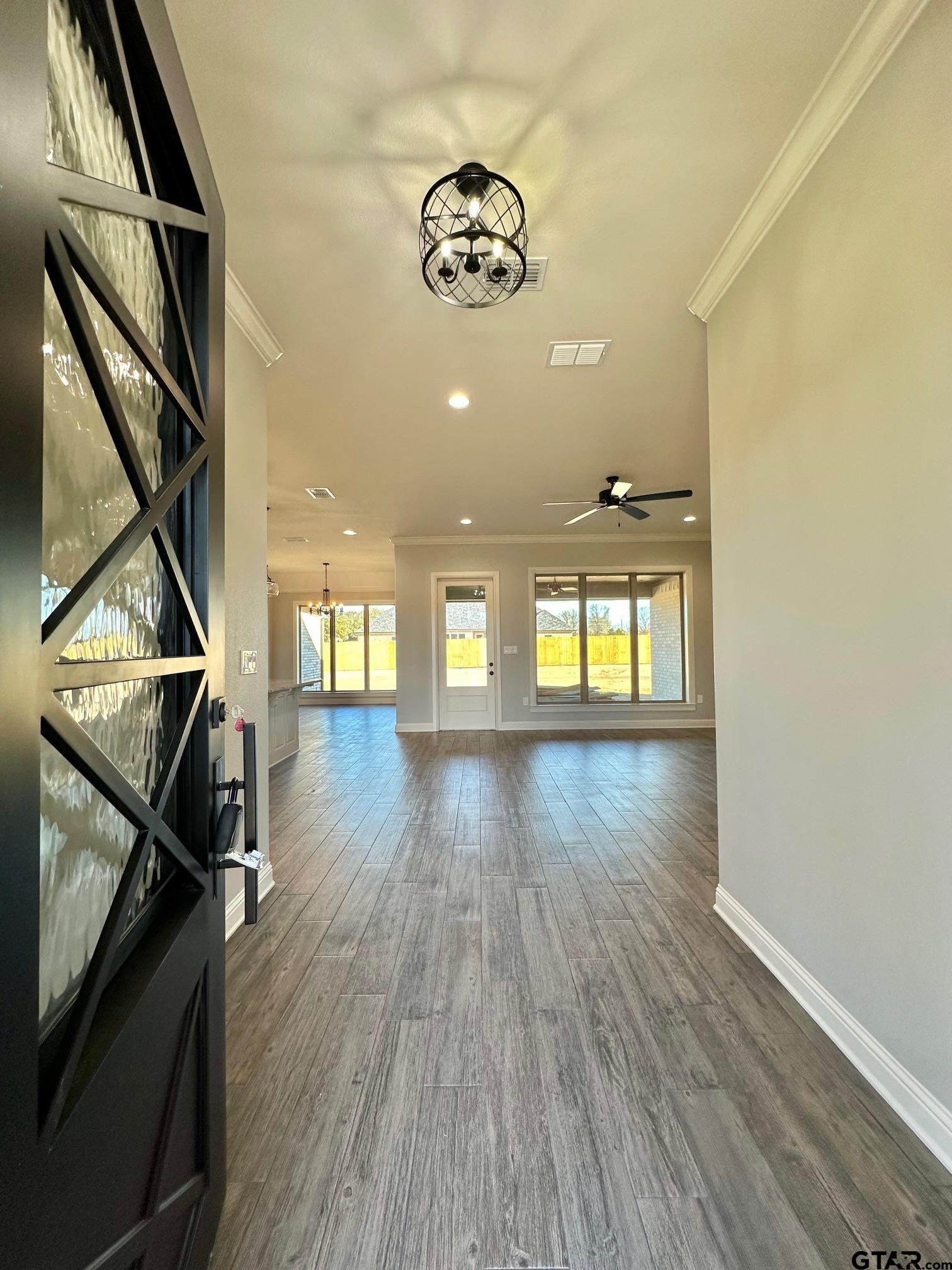 229 Brooks Drive Gladewater, TX 75647 - Photo 8 of 46 a view of an entryway with wooden floor