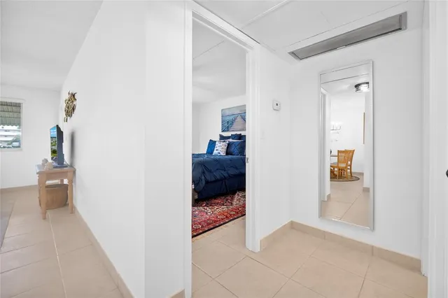 a view of a hallway and a livingroom with a hallway