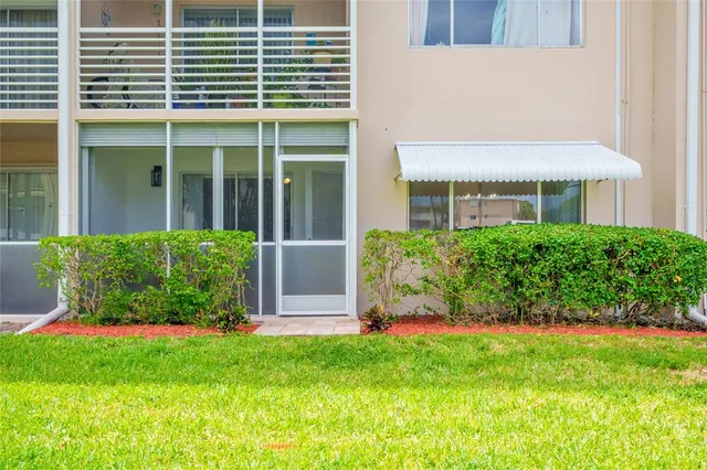 a view of house with backyard