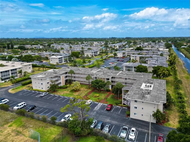 an aerial view of a house with a swimming pool