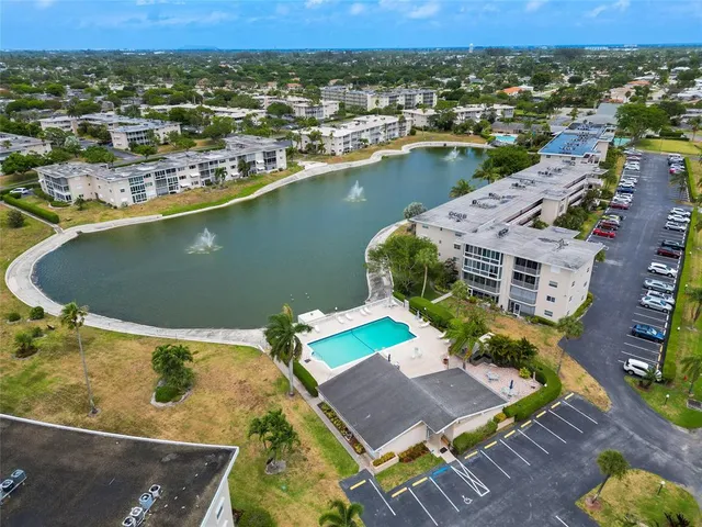 an aerial view of a house with a lake view