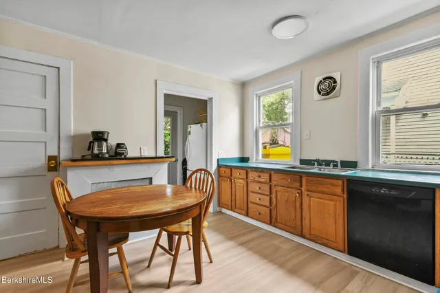 a kitchen with a table and chairs in it
