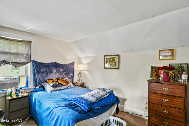 a bed room with a bed and a couch