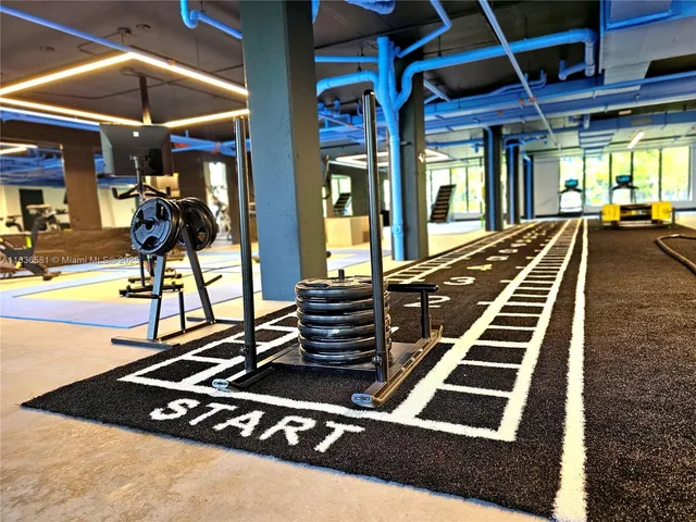 a bed sitting in front of a building