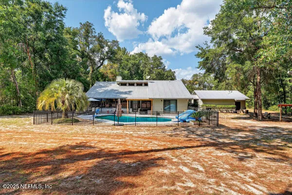a kitchen with microwave a stove and refrigerator