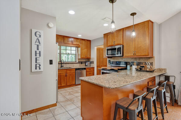 6519 Neale Road Melrose, FL 32666 - Photo 17 of 57 a kitchen with microwave a stove and refrigerator