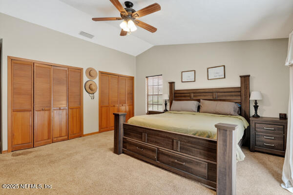 6519 Neale Road Melrose, FL 32666 - Photo 31 of 57 a bedroom with a bed and a chandelier