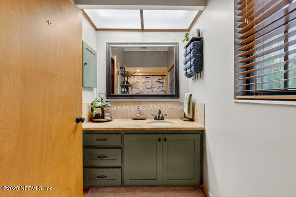 6519 Neale Road Melrose, FL 32666 - Photo 41 of 57 a bathroom with a sink and a mirror