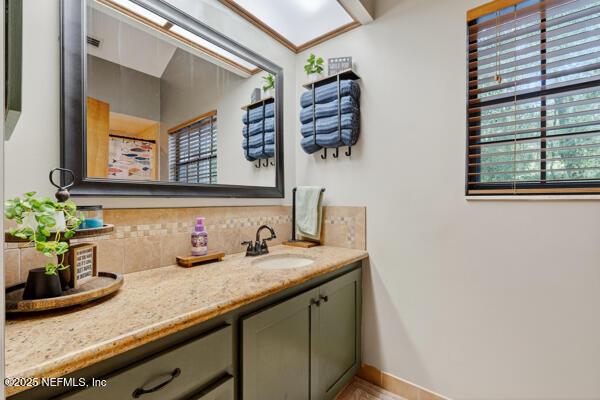 6519 Neale Road Melrose, FL 32666 - Photo 42 of 57 a bathroom with a sink and a mirror