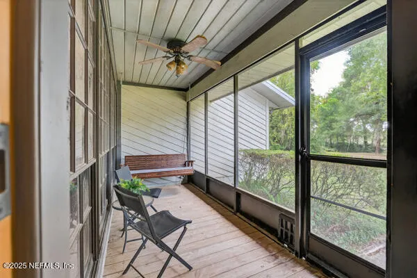 a room with wooden floor and furniture