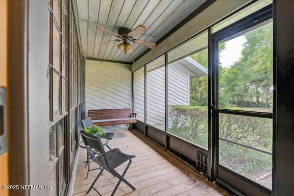 6519 Neale Road Melrose, FL 32666 - Photo 5 of 57 a room with wooden floor and furniture