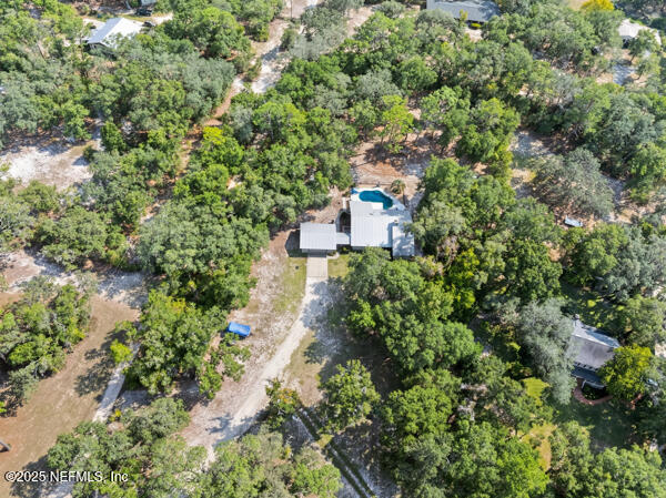 6519 Neale Road Melrose, FL 32666 - Photo 52 of 57 an aerial view of a house with a yard and garden