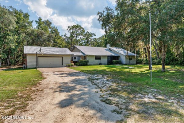 6519 Neale Road Melrose, FL 32666 - Photo 6 of 57 a house view with a outdoor space