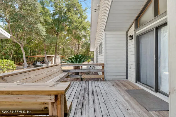 a house view with a sitting space and garden