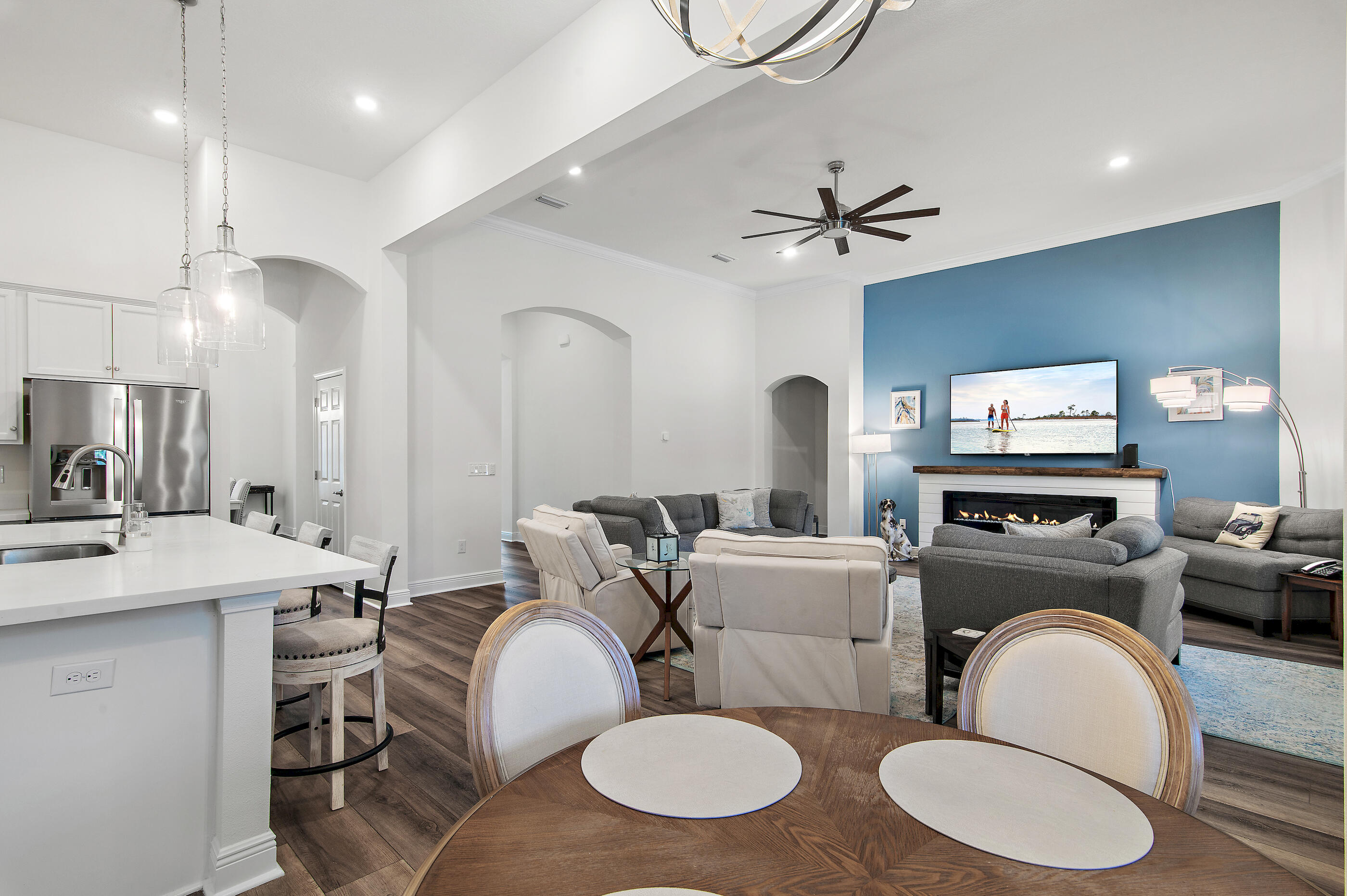 588 Windswept Boulevard Freeport, FL 32439 - Photo 13 of 62 a living room with furniture a fireplace and white walls