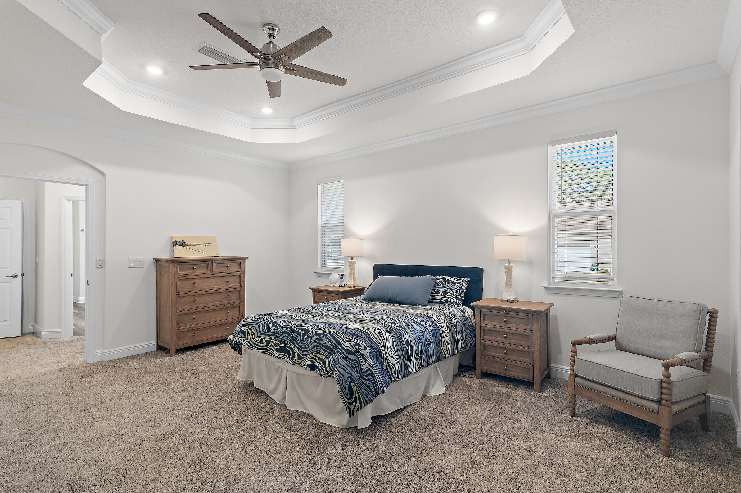 588 Windswept Boulevard Freeport, FL 32439 - Photo 19 of 62 a bedroom with a bed a couch and dresser