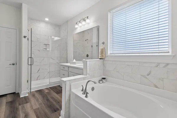 a bathroom with a toilet sink and a shower