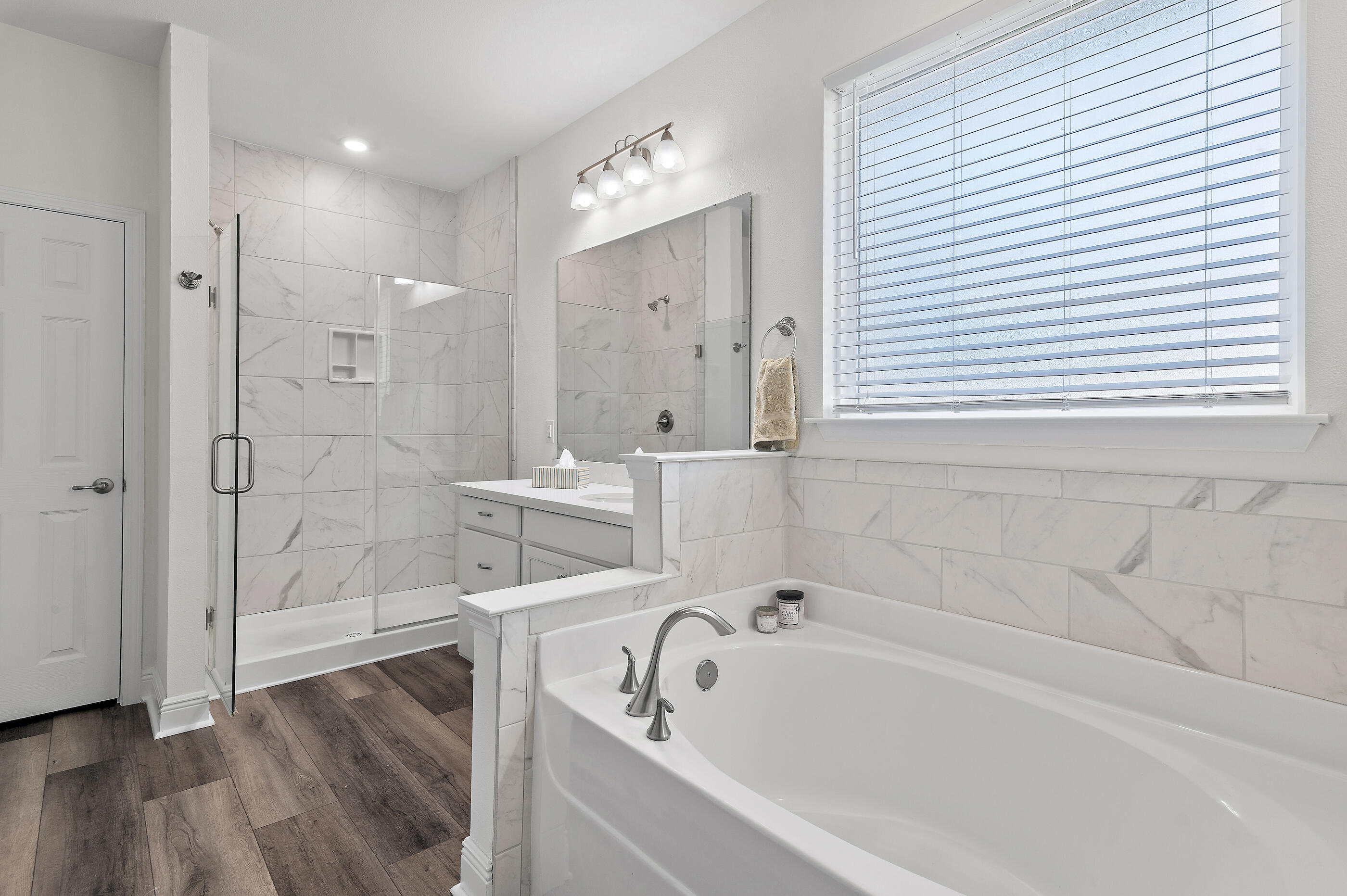 588 Windswept Boulevard Freeport, FL 32439 - Photo 24 of 62 a bathroom with a bathtub and a shower