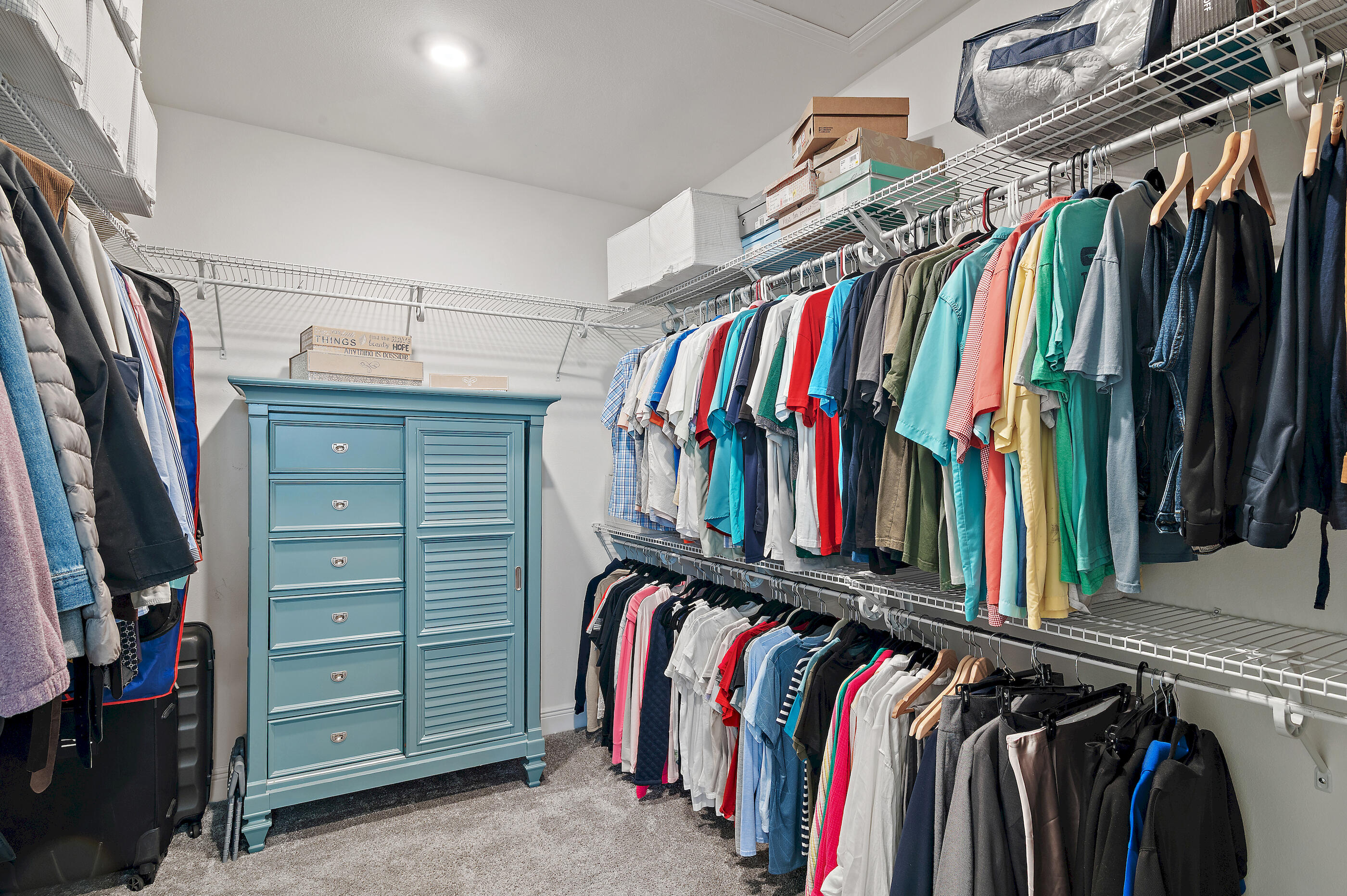 588 Windswept Boulevard Freeport, FL 32439 - Photo 25 of 62 a view of walk in closet with clothes