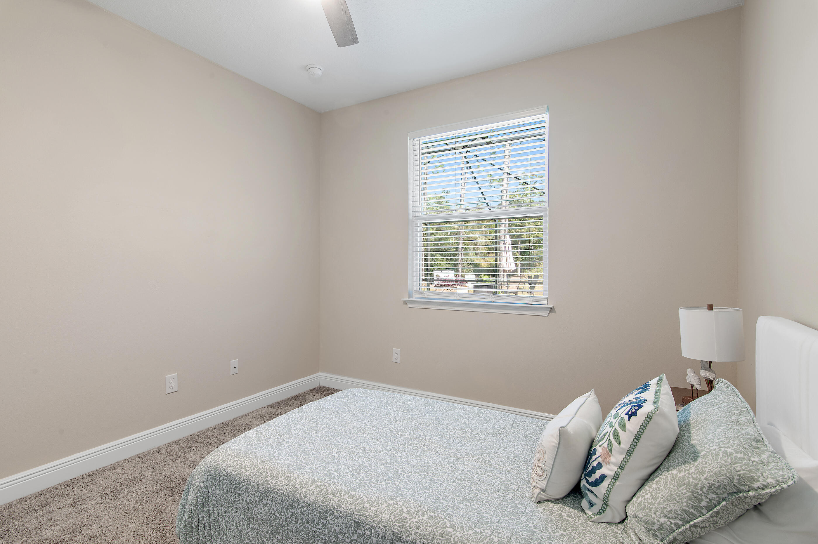 588 Windswept Boulevard Freeport, FL 32439 - Photo 29 of 62 a bedroom with a bed and a window