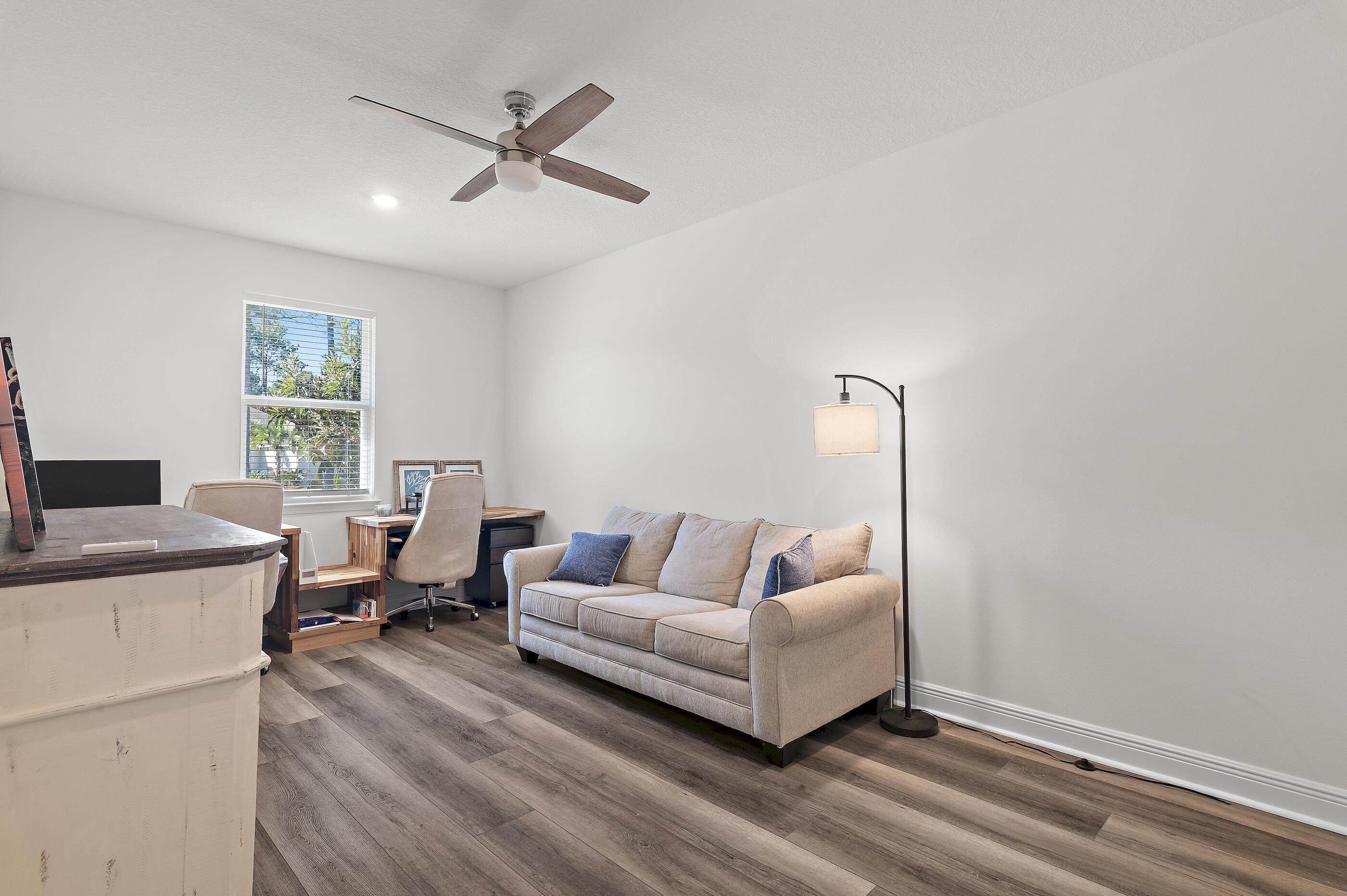 588 Windswept Boulevard Freeport, FL 32439 - Photo 33 of 62 a living room with furniture and a window