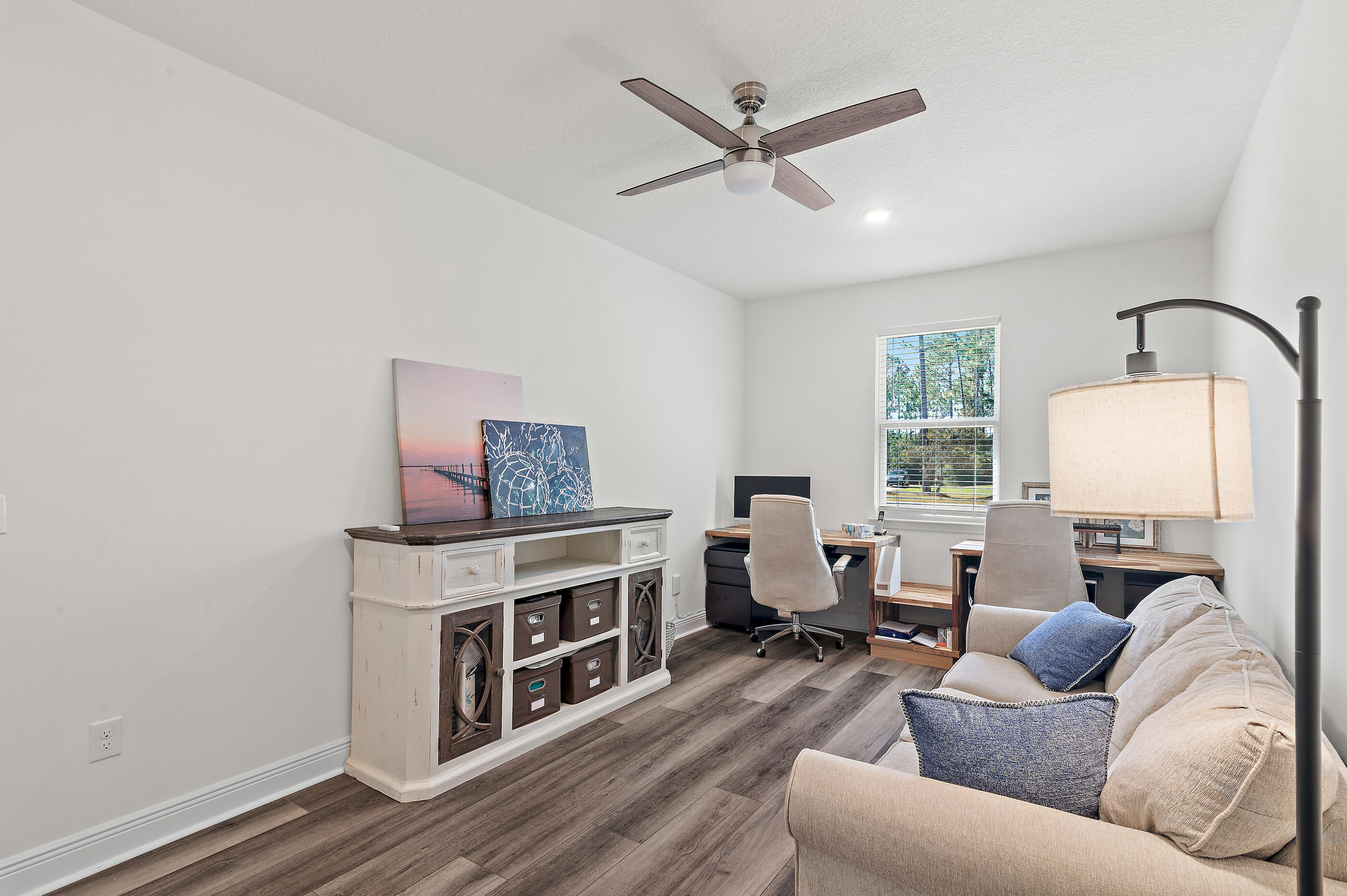 588 Windswept Boulevard Freeport, FL 32439 - Photo 34 of 62 a living room with furniture and a fireplace