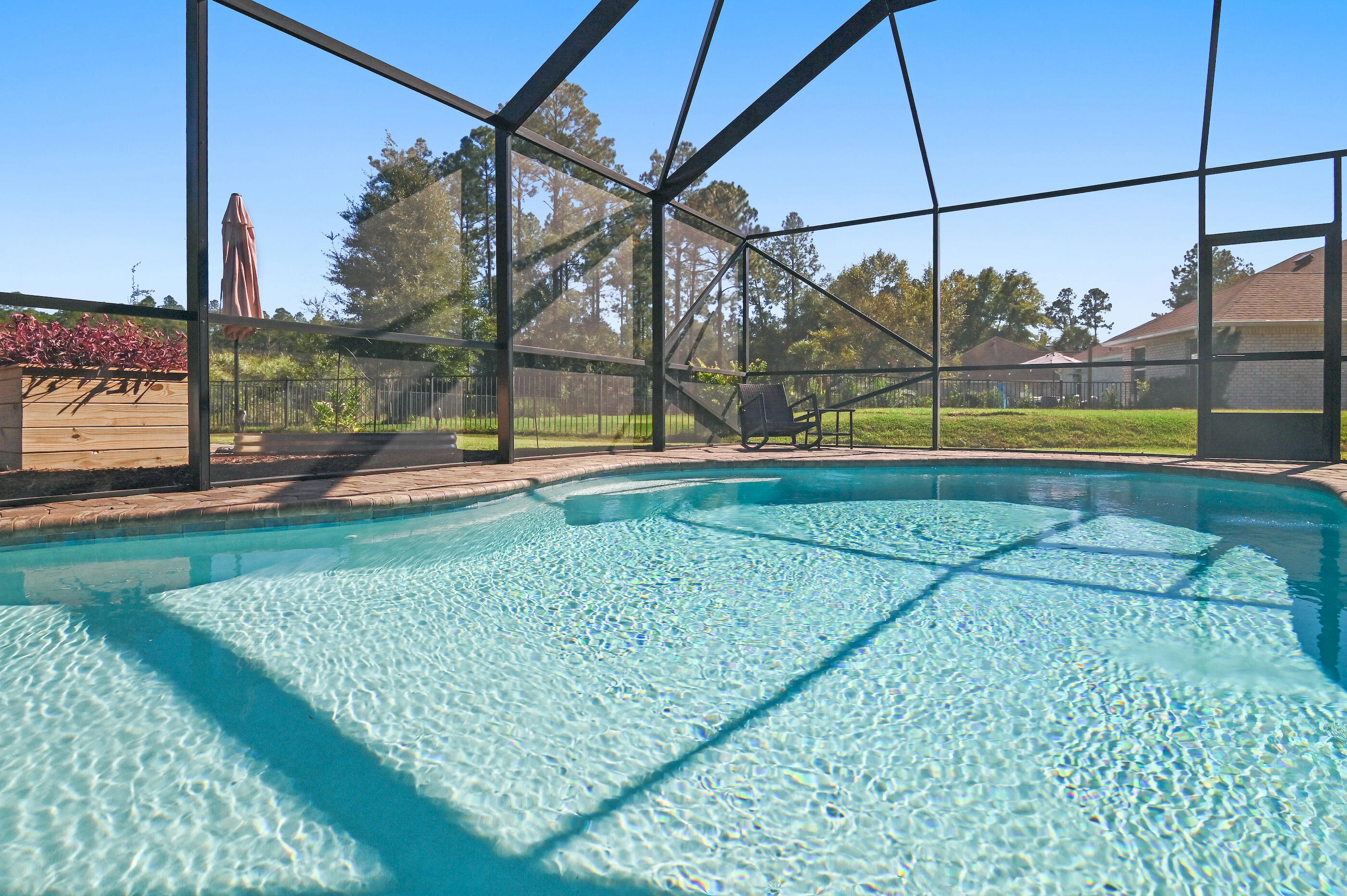 588 Windswept Boulevard Freeport, FL 32439 - Photo 39 of 62 a view of a swimming pool with a yard
