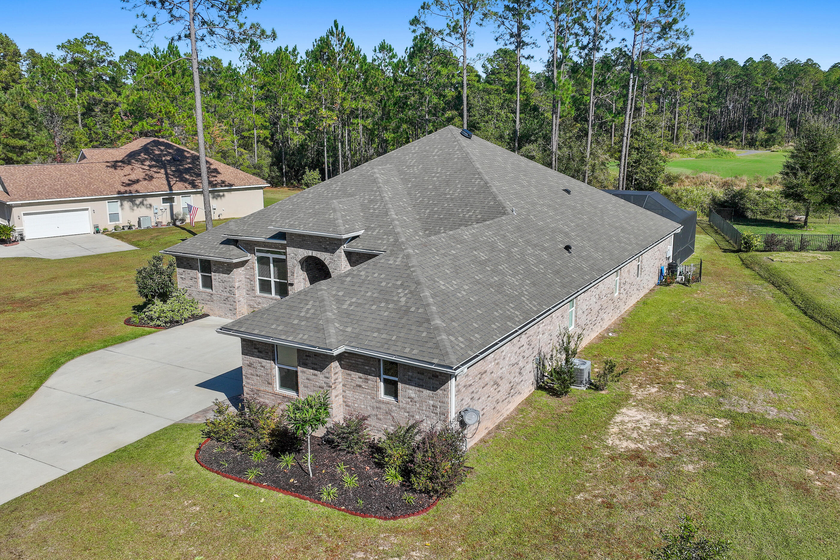 588 Windswept Boulevard Freeport, FL 32439 - Photo 42 of 62 an aerial view of a house with a yard