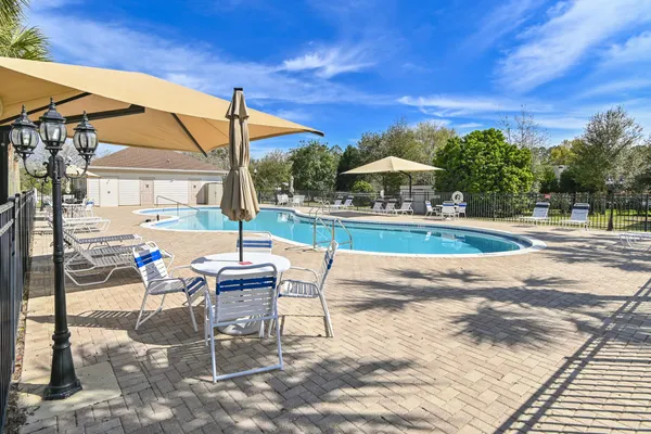 a view of a swimming pool with a yard