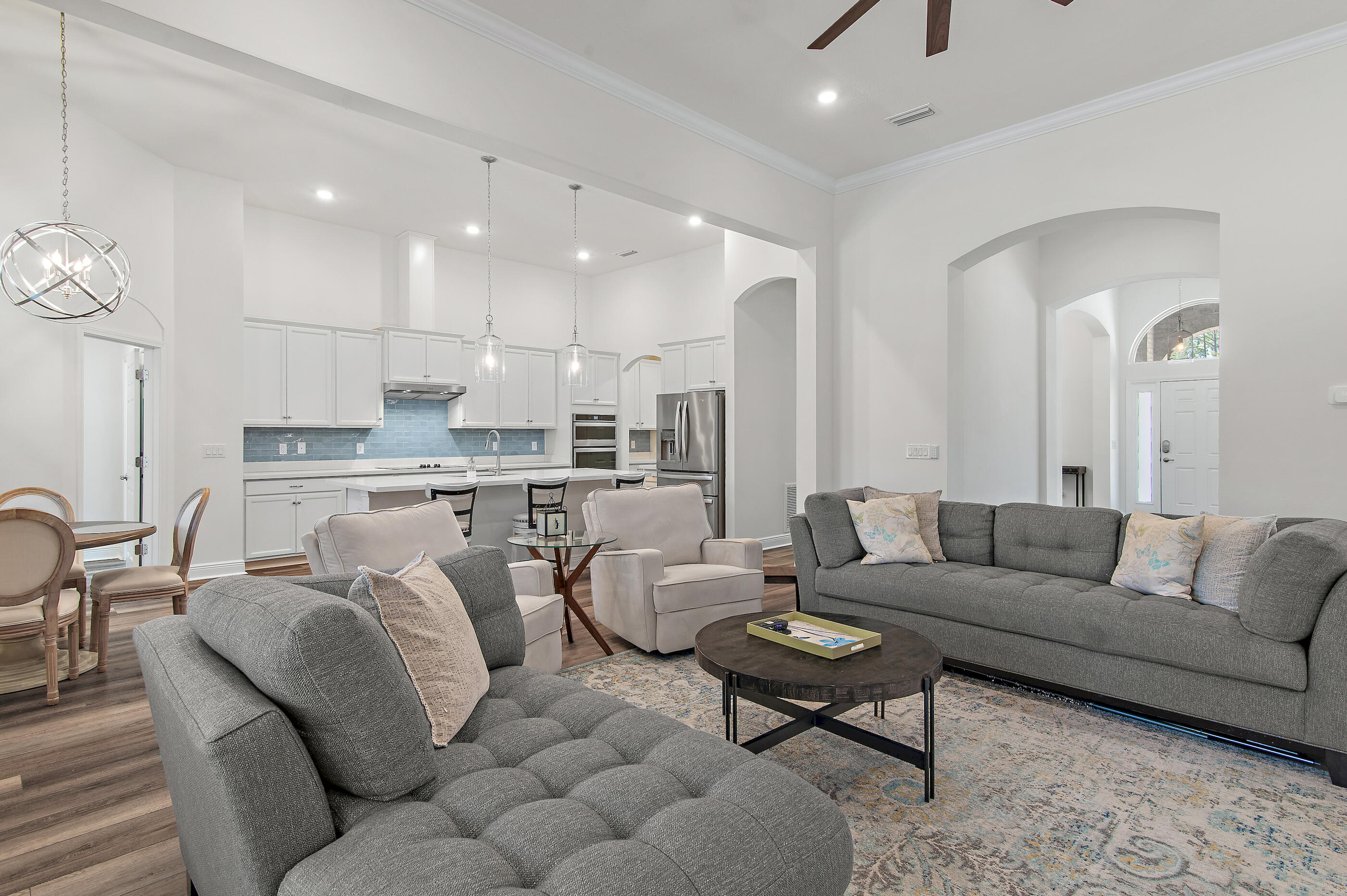 588 Windswept Boulevard Freeport, FL 32439 - Photo 6 of 62 a living room with furniture kitchen and a table