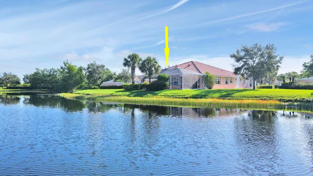a view of a lake with houses on both side of river