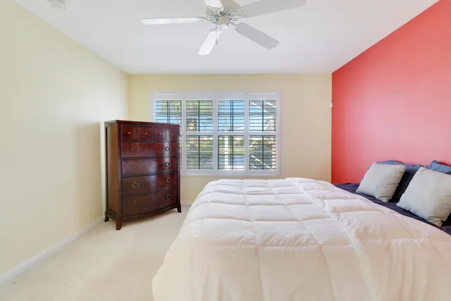 a bathroom with a double vanity sink toilet mirror and shower