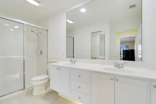 a bedroom with a bed and a lamp