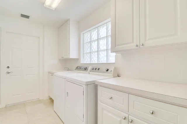 a view of empty room with floor to ceiling windows