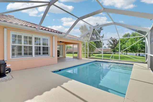 a open area with glass windows and garden view